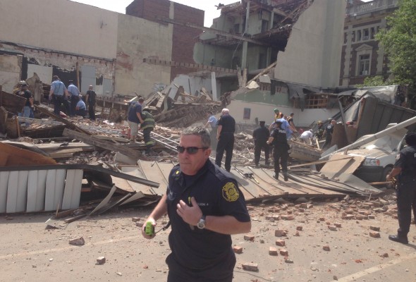 Student Aids Victims on the Scene of Building Collapse