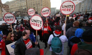 Photo credited to Philly.comStudents, teachers, and parents protest out side school headquarters.